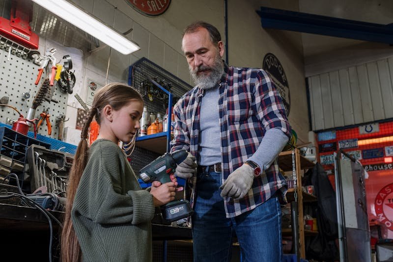 Parent teaching child crafts